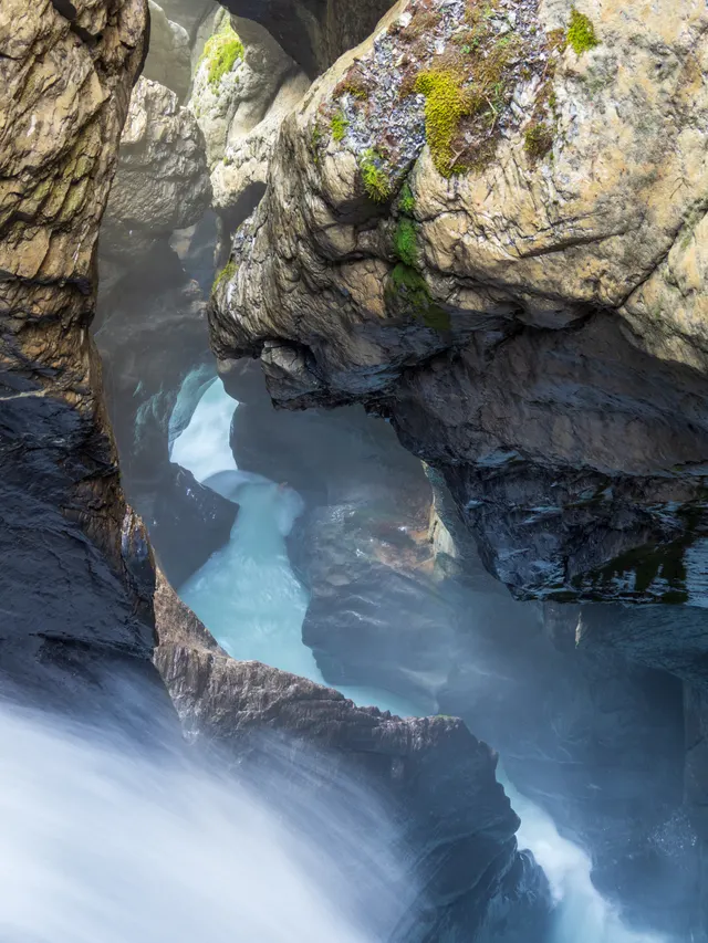 Glacier meltwater cutting through the rock inside the Trümmelbach gorge